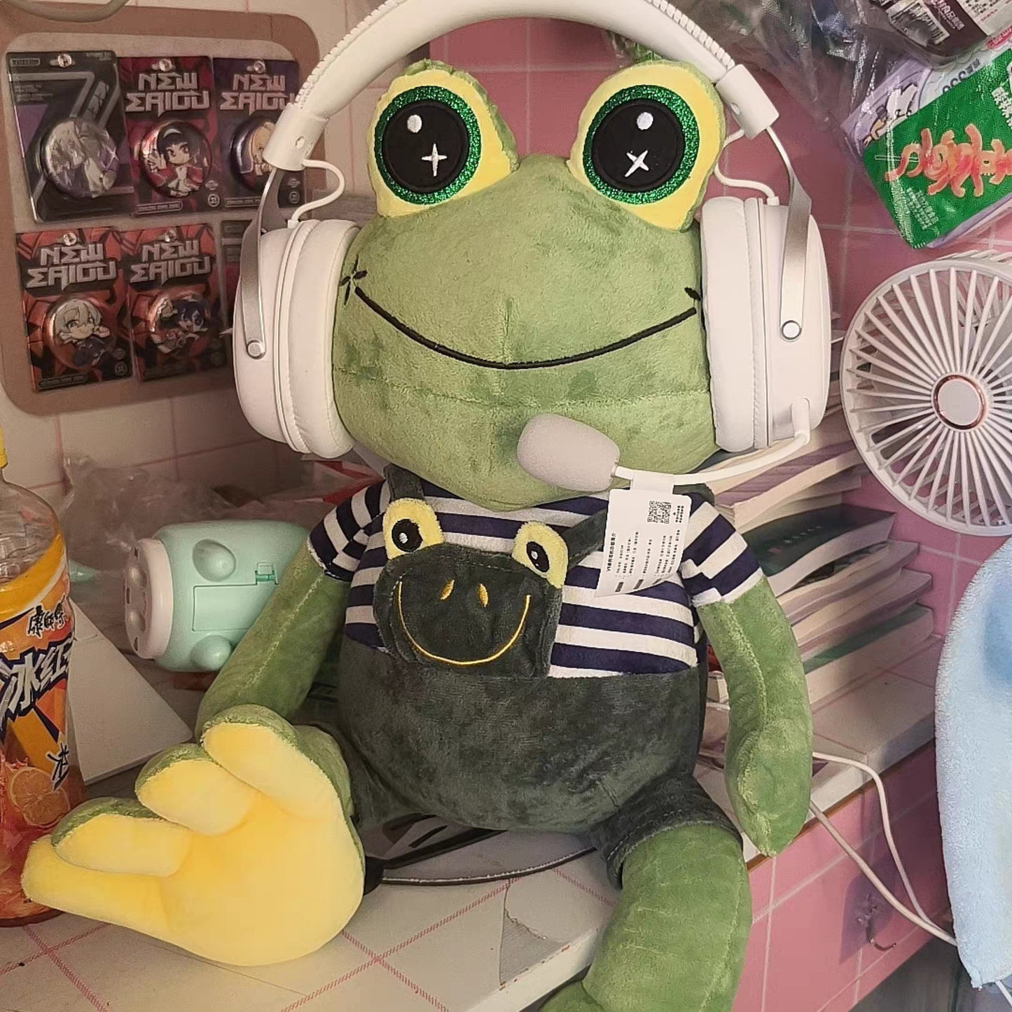 Jab Jabich CS2 coach meme plush close up — green frog plushie with big eyes and striped blue shirt, natural daylight