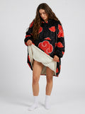 Red cloud black wearable blanket hoodie worn by model, front view showing white sherpa lining at the hem