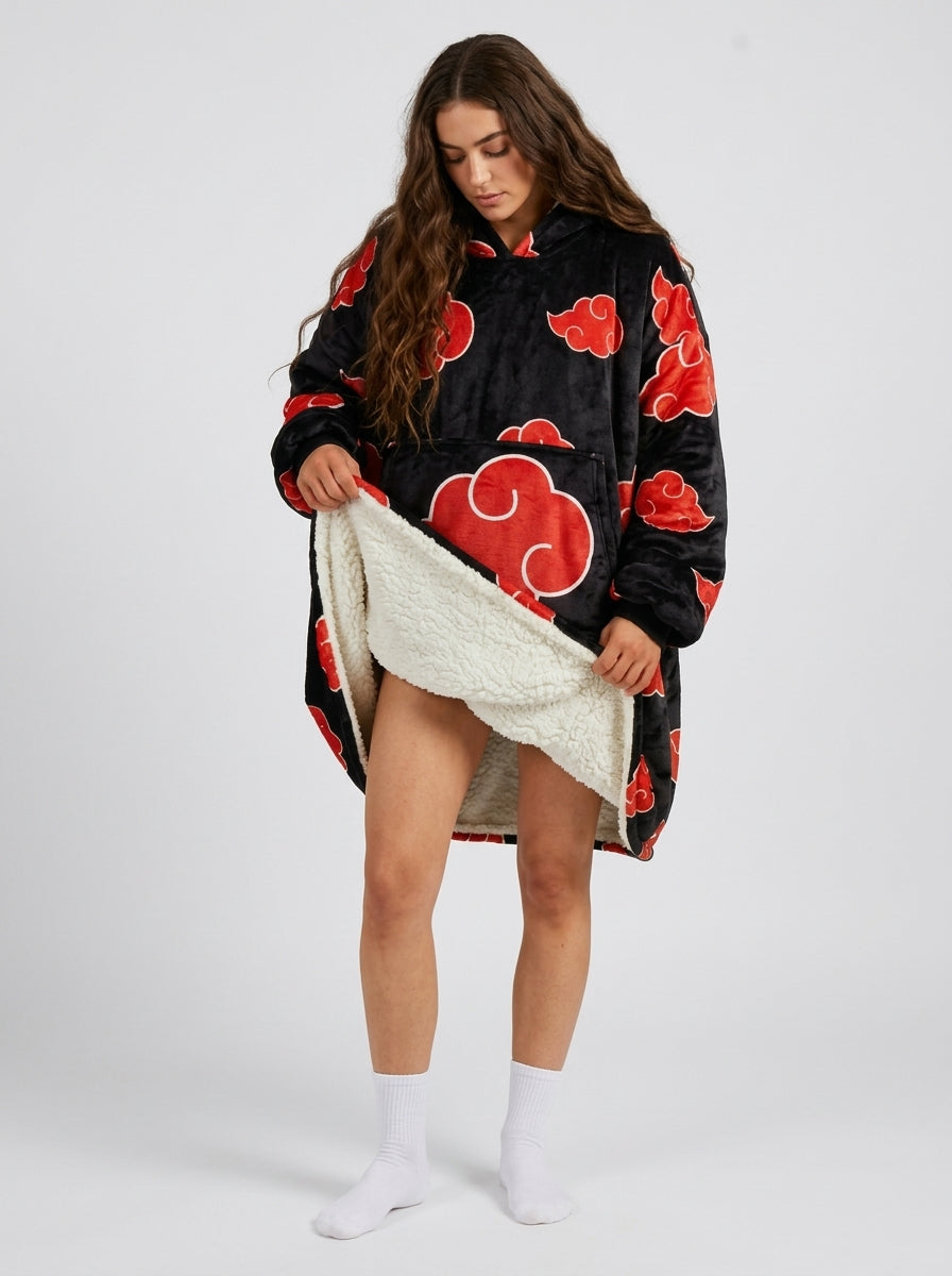 Red cloud black wearable blanket hoodie worn by model, front view showing white sherpa lining at the hem