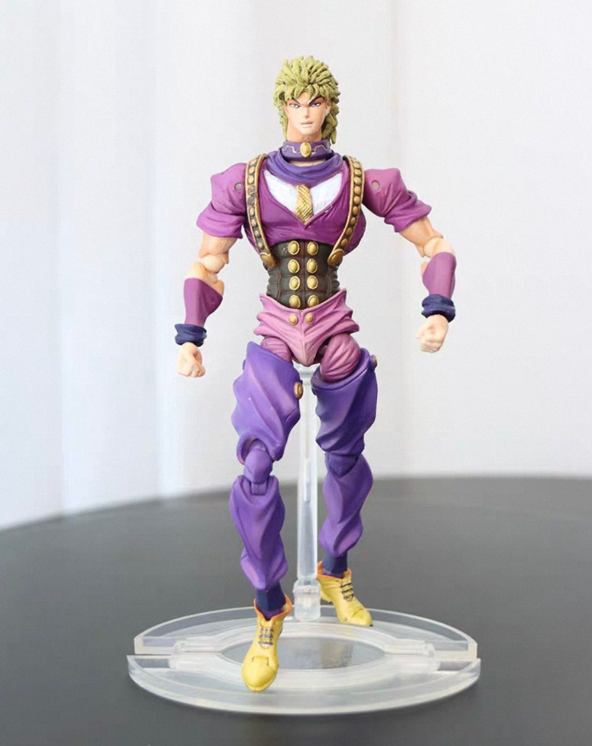 Dio Brando figure from JoJo's Bizarre Adventure, full front view of the collectible statue in his purple outfit on a clear display stand