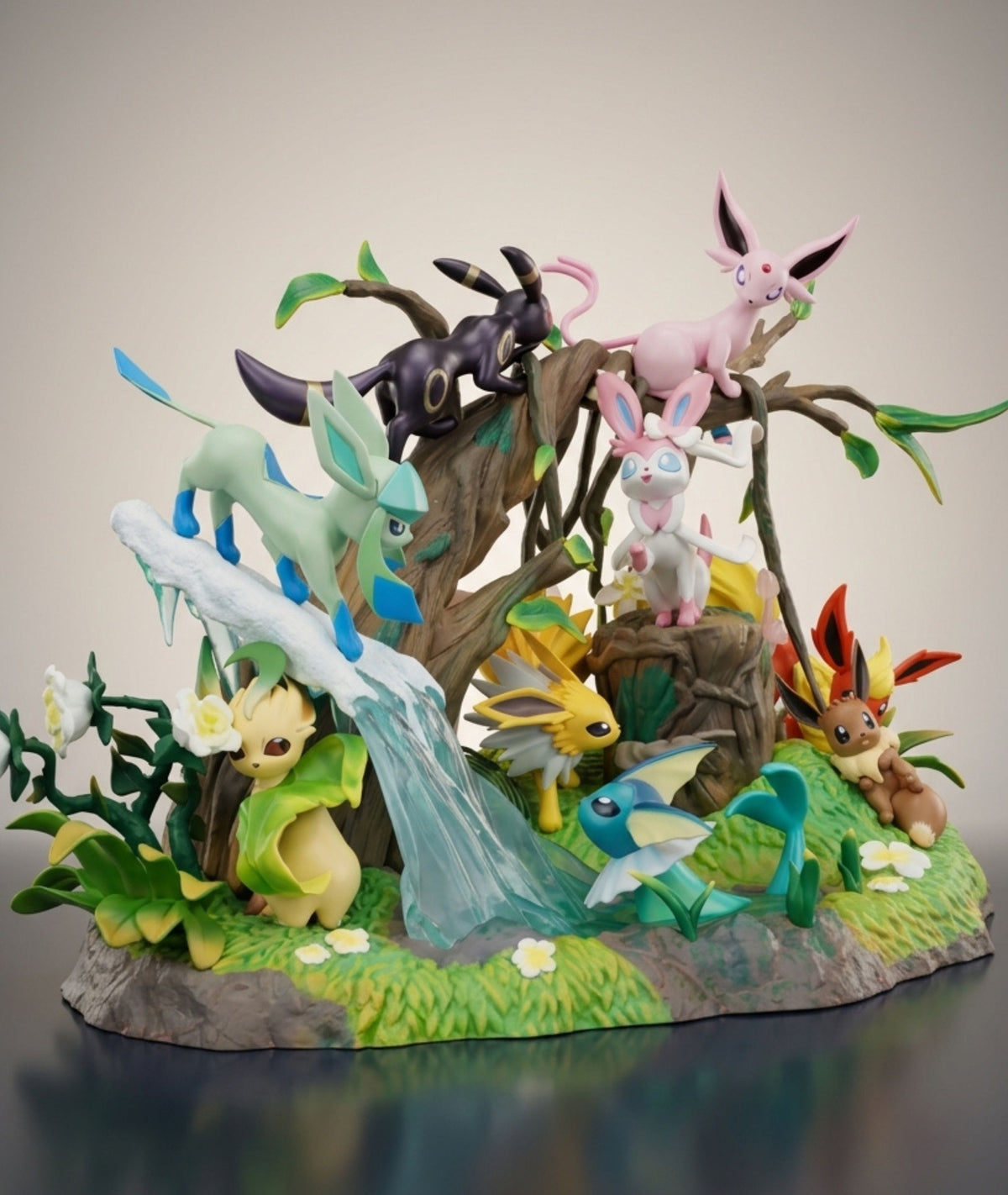 Eeveelution Pokemon display statue side view showing tree, waterfall and flower detailing