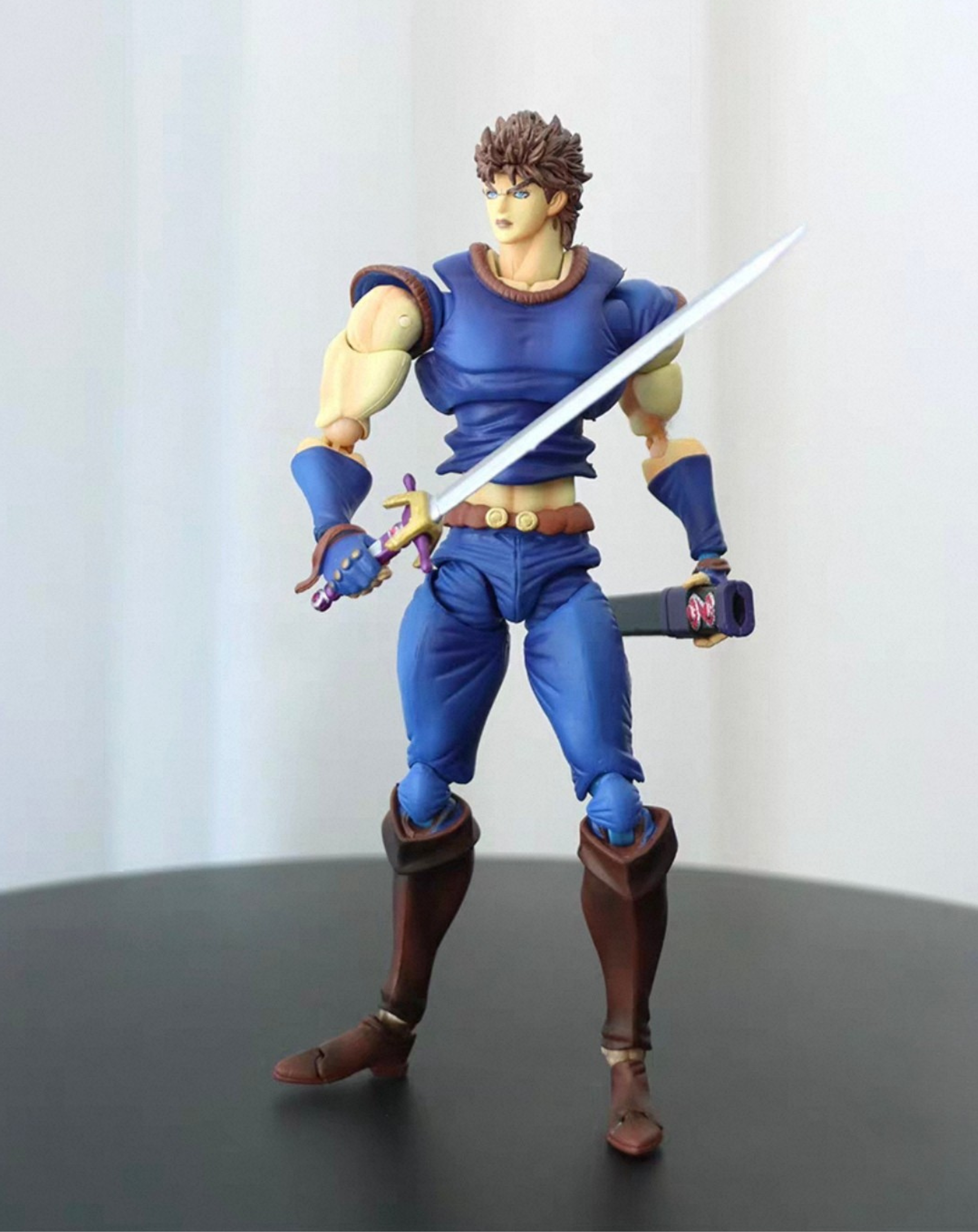 Jonathan Joestar figure from JoJo's Bizarre Adventure, full front view of the collectible statue in his blue outfit holding a sword