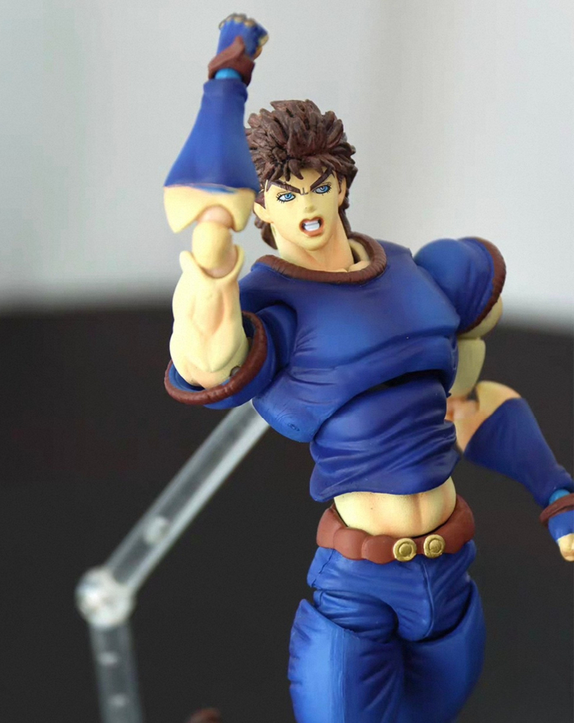 Jonathan Joestar JoJo figure in a dynamic action pose, front view leaning forward with the flowing blue costume detailing shown