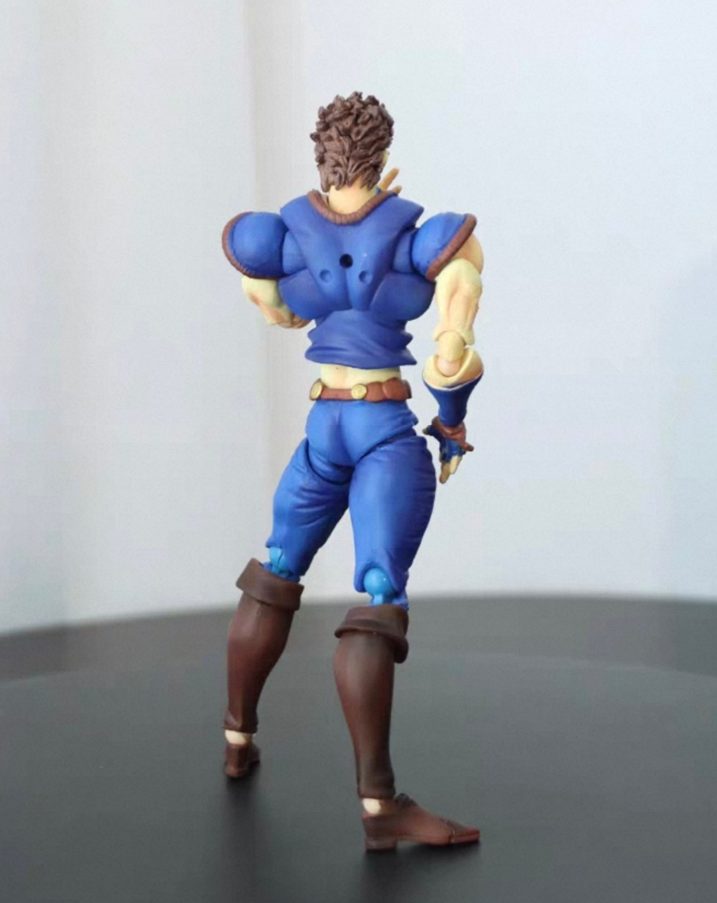 Jonathan Joestar JoJo's Bizarre Adventure figure, three-quarter front angle showing the blue uniform and confident collectible pose
