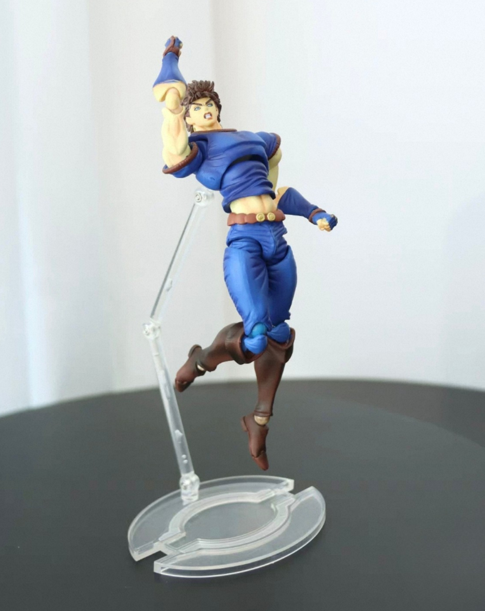 JoJo's Bizarre Adventure Jonathan Joestar collectible, side action angle with the sword extended and figure mounted on its stand