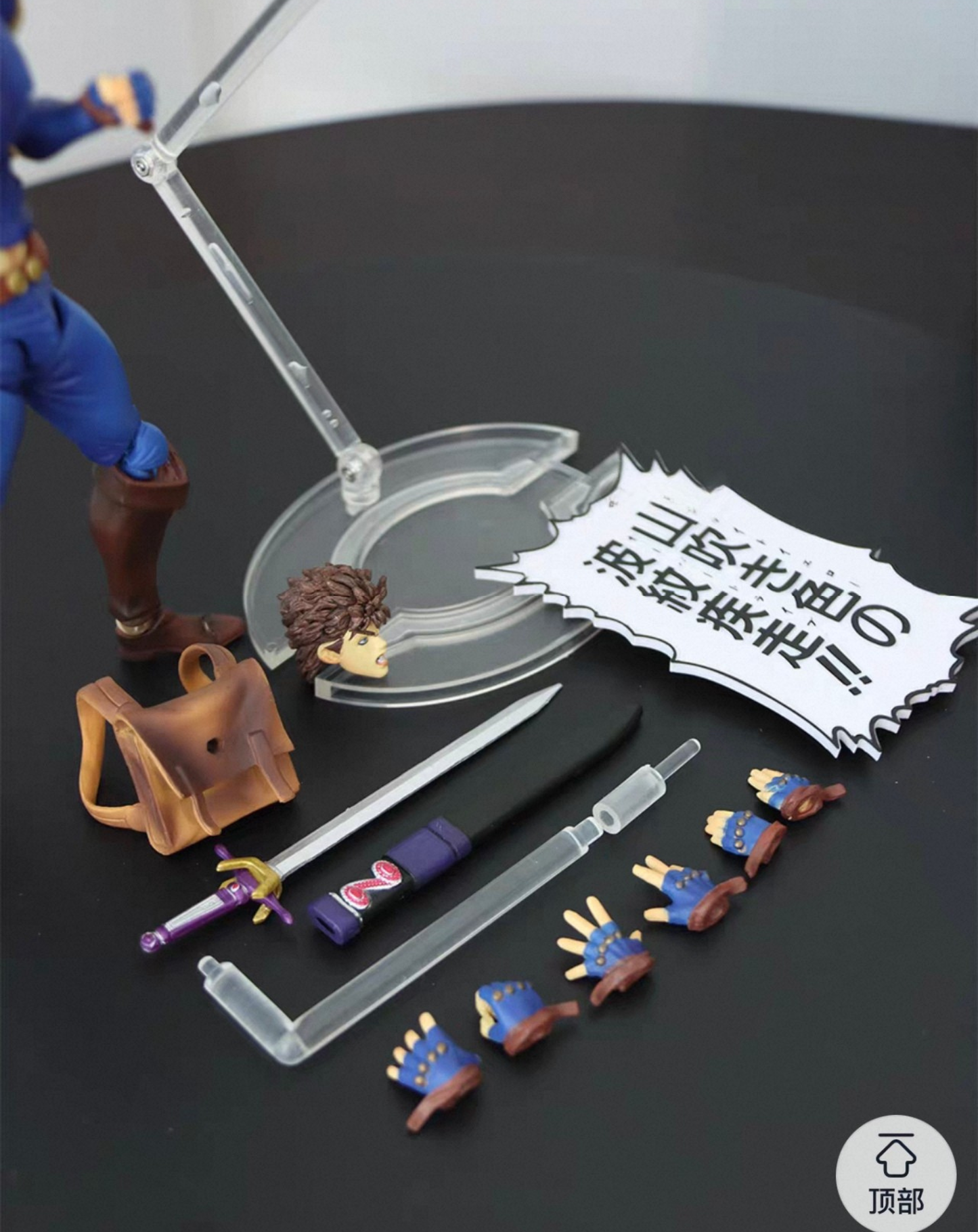 JoJo Jonathan Joestar statue with display base and small accessories arranged on the surface, angled collectible product view