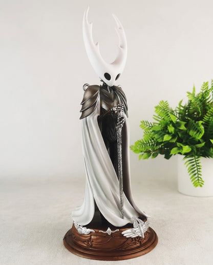 Pure Vessel figure side profile on its base, 30cm Hollow Knight collectible showing the cloak and mask sculpt
