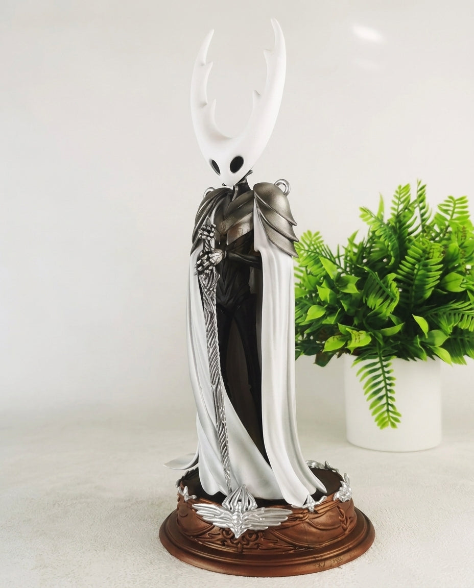 Hollow Knight Pure Vessel statue, front pose showing the horned mask and flowing cloak in full body view