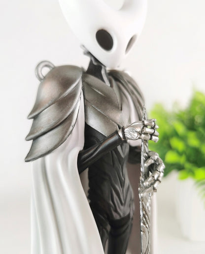 Close-up of the Pure Vessel figure's horned mask and face, detail shot of the Hollow Knight collectible sculpt