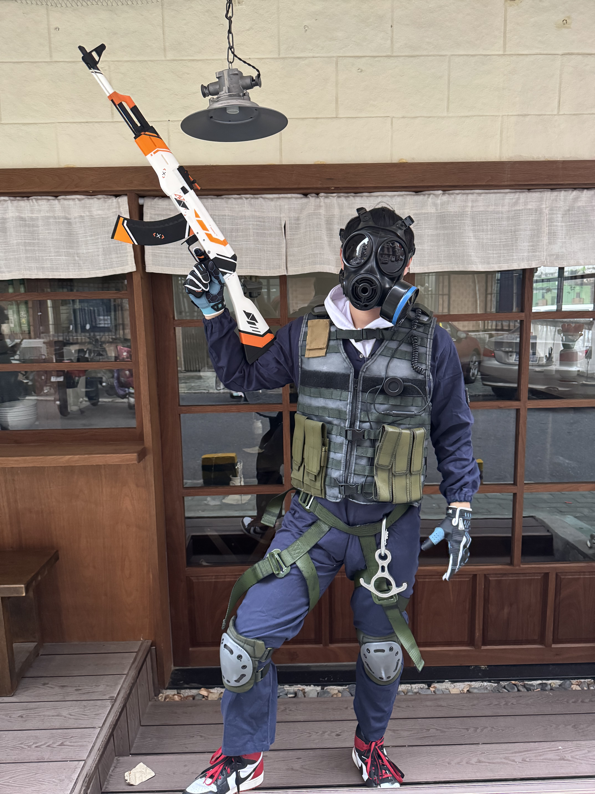Life size CS2 inspired Asiimov AK-47 collectible prop — 1:1 scale replica held by a full body CT cosplay from Counter Strike
