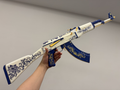 Real life size CS2 Inheritance AK-47 replica on display stand — 1:1 scale plastic collectible, dark studio background, full length side view