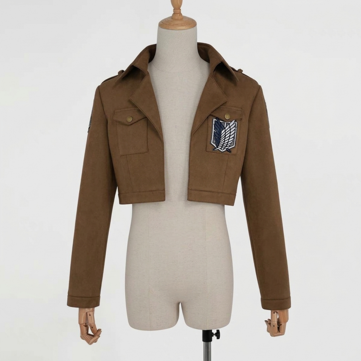 Wings emblem cosplay jacket in brown with front flap pockets and chest patch, front view on mannequin