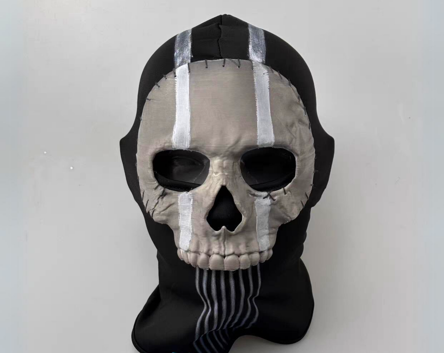 Ghost skull mask from Call of Duty Modern Warfare 2, 3D printed white skull face plate on black ribbed balaclava, front view on white background
