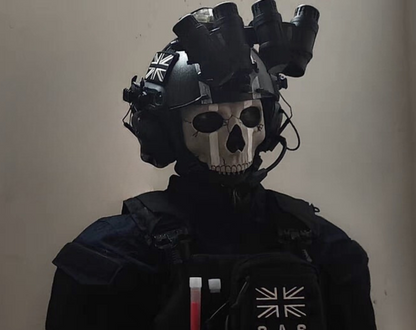 Person wearing Ghost MW2 cosplay full kit — skull balaclava, tactical vest, and gloves at indoor airsoft event
