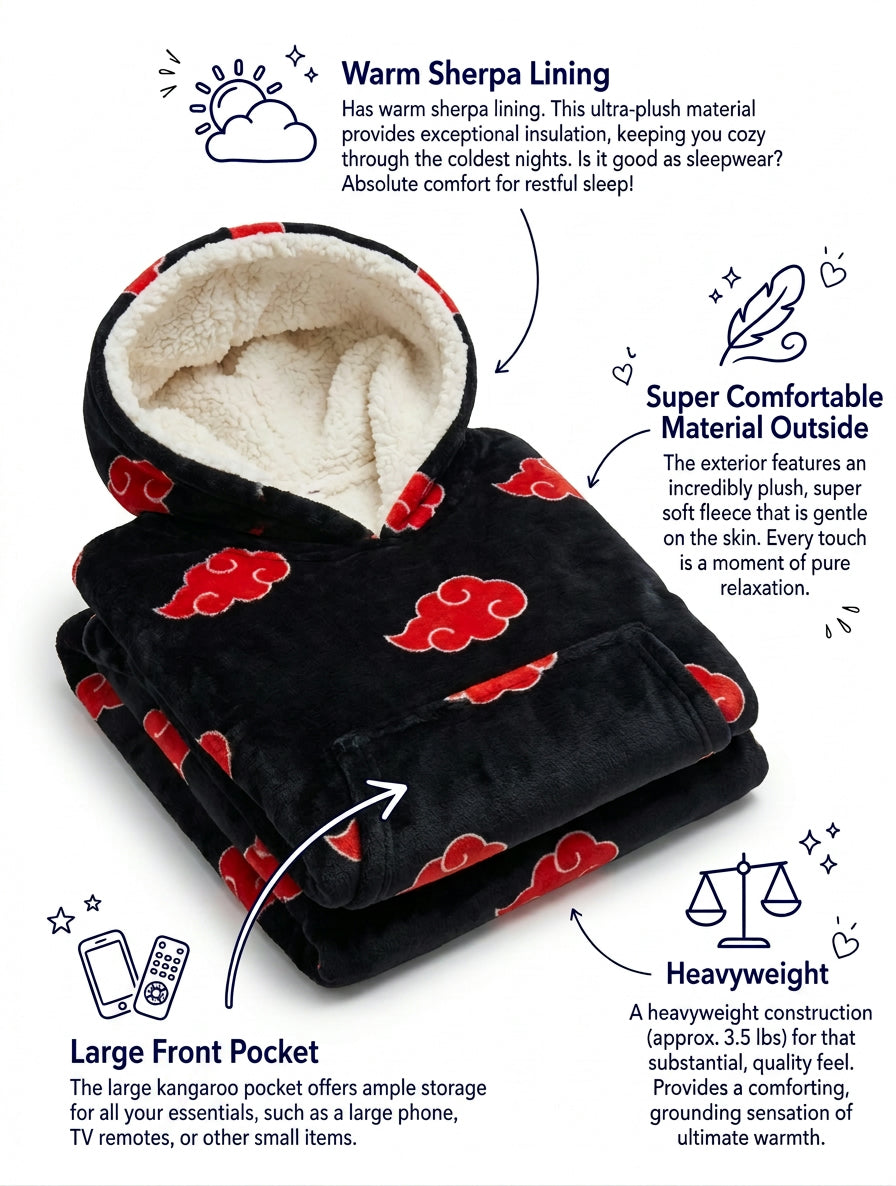 Folded black blanket hoodie with red clouds and sherpa lined hood, feature detail view with front pocket