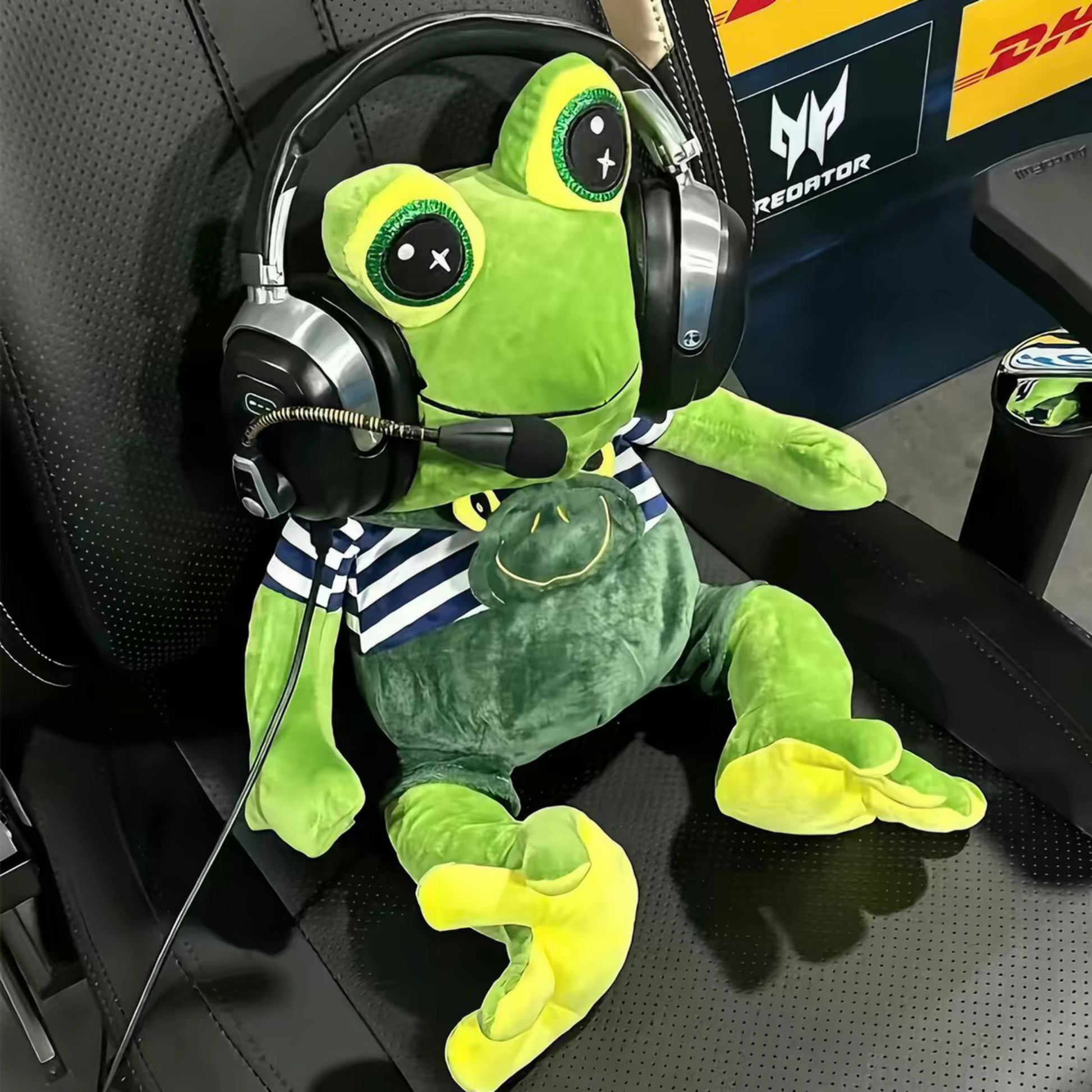 Jab Jabich plushie on desk setup — CS2 meme frog plush next to gaming setup, ambient lighting