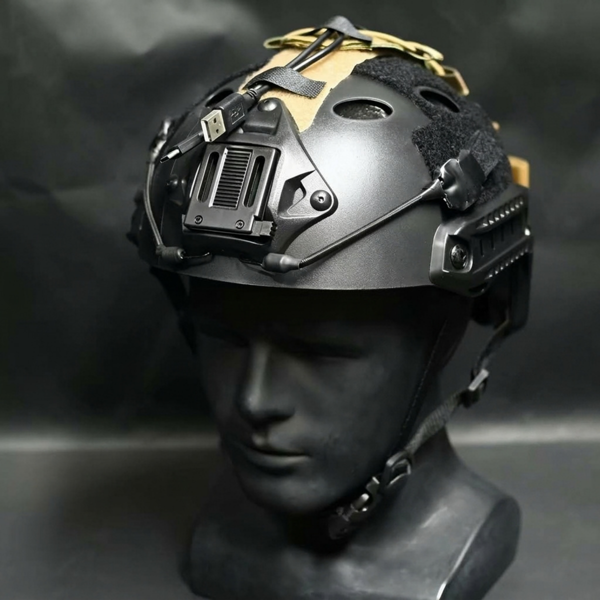 Konig cosplay tactical helmet in black with gold accents on mannequin head, front three quarter view