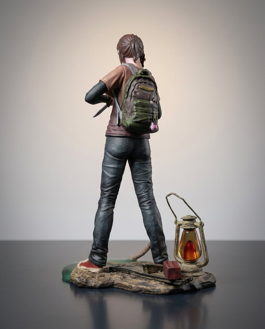 The Last of Us Ellie figure rear view with the detailed backpack and hair, back angle of the 19cm statue