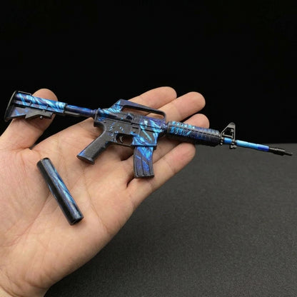 Mini CS2 M4A1-S Nightmare replica held in hand — 1:6 scale zinc alloy metal collectible, dark studio background, size reference shot