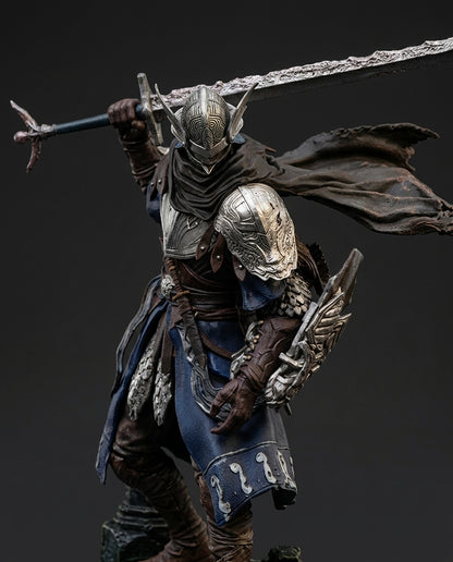 Close-up detail shot of the Wylder figurine's armor plating, showing fine sculpted texture, weathering effects, and hand-painted metallic finish on the shoulder guards