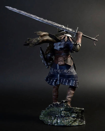 Back view of the Wylder figurine showing the flowing cloth cape, back armor plating, and greatsword strap detailing sculpted for full 360-degree display accuracy