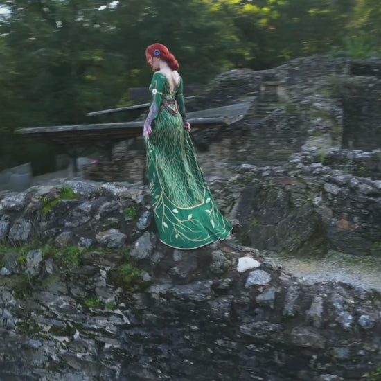 Triss Merigold cosplay video showing full outfit movement in forest setting