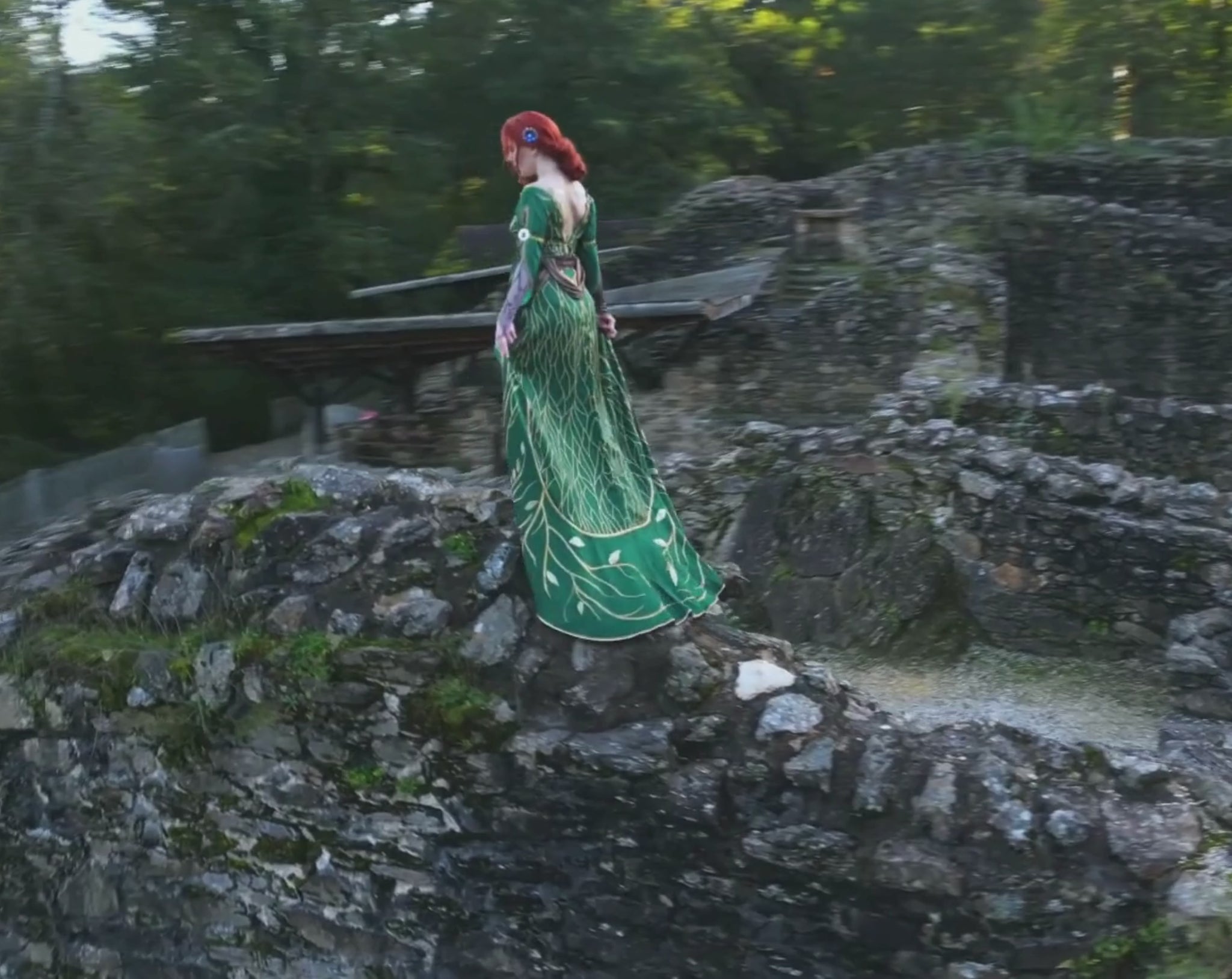 Triss Merigold cosplay video showing full outfit movement in forest setting