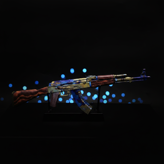 CS2 AK47 Case Hardened mini replica on display stand, vibrant blue purple and gold case-hardened splash pattern under studio lighting