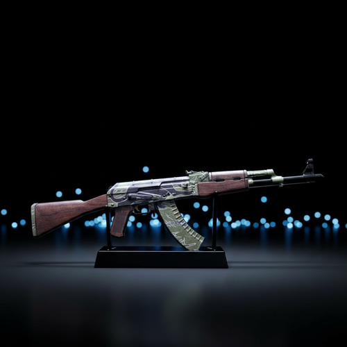 CS2 AK47 Jaguar mini replica on display stand, dark body with green camo and orange print pattern under blue studio lighting