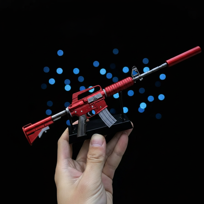 Mini CS2 M4A1-S Hot Rod replica held in hand — 1:6 scale zinc alloy collectible, dark studio lighting, size reference photo