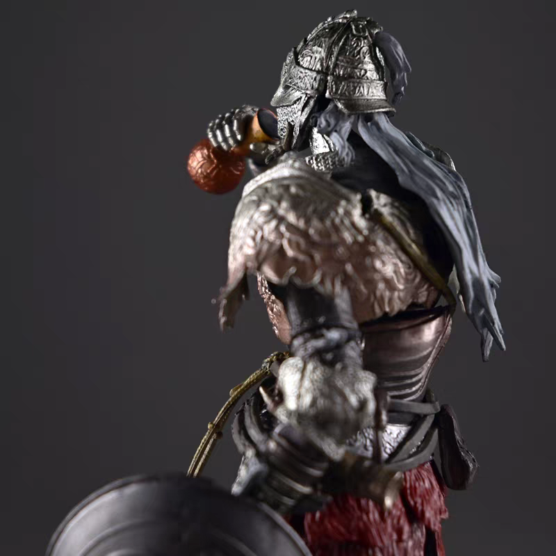 Elden Ring Raging Wolf Tarnished knight statue side profile, showing the flowing cloak and layered armor sculpt