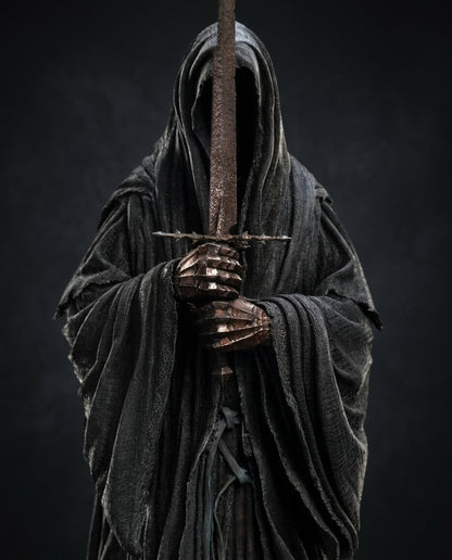 Full front view of the Ringwraith of Mordor statue showing the hollow hood and layered robe folds cascading to the base