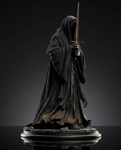 Side angle view of the Ringwraith of Mordor collectible statue highlighting the sword and cloak drape
