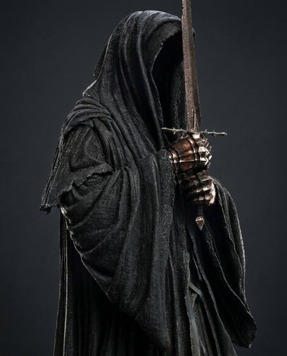 Side angle view of the Ringwraith of Mordor collectible statue highlighting the sword and cloak drape