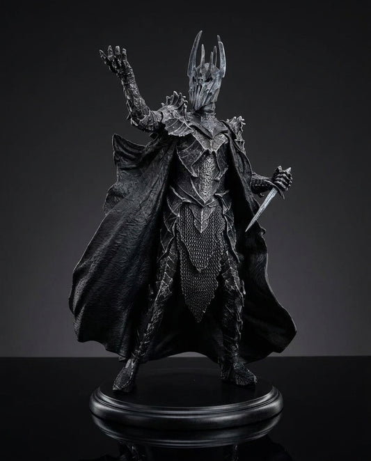 Full front view of the Sauron statue showing the flowing dark cloak and towering armored silhouette