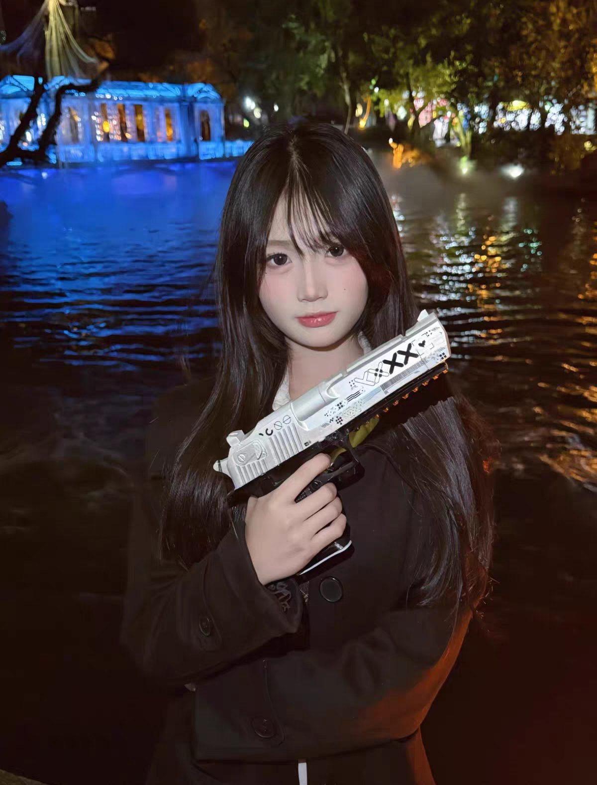 Person holding CS2 Desert Eagle Printstream real life replica at night — white and black XX skin detail, atmospheric city lights and water reflection background, lifestyle cosplay shot