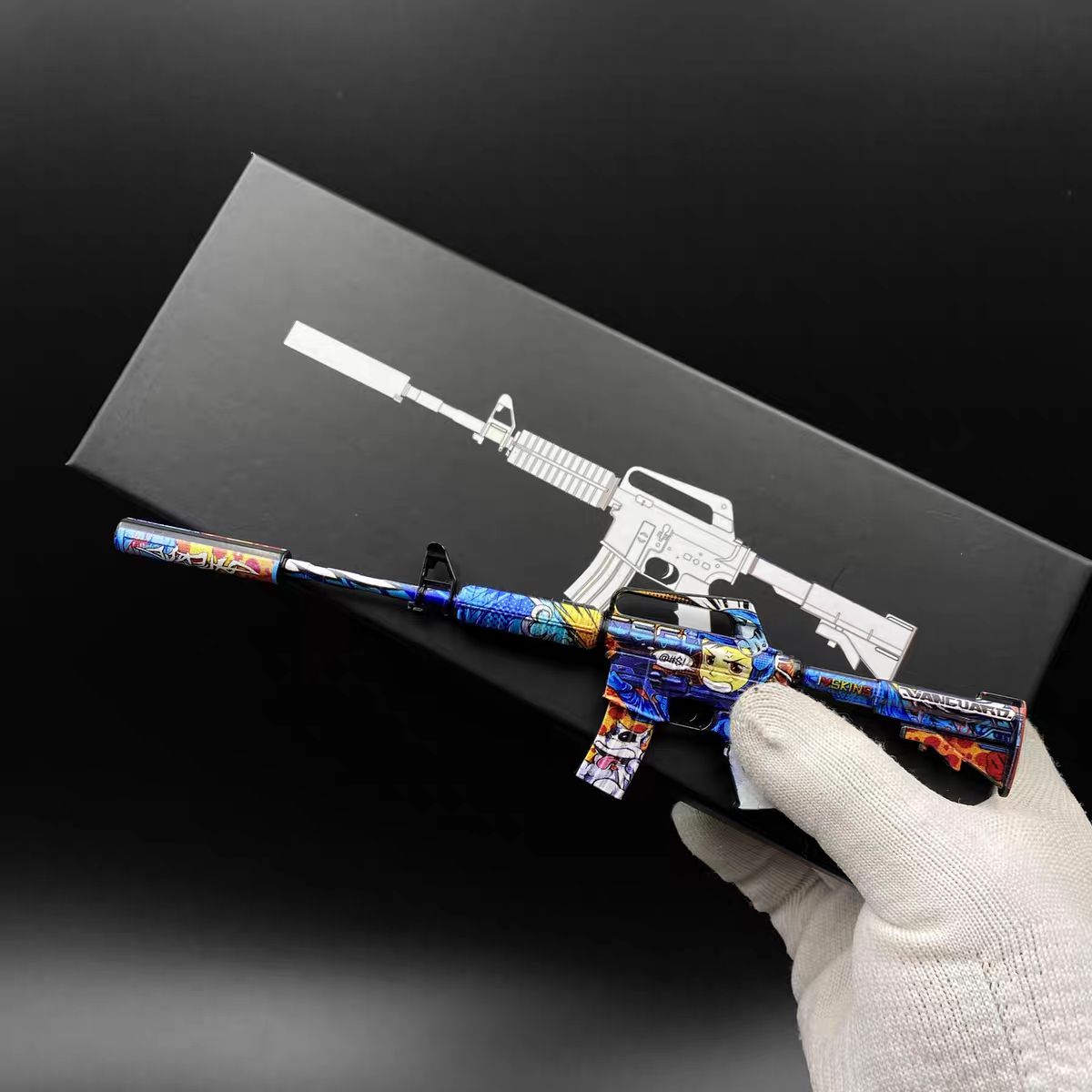 Mini CS2 M4A1-S Player Two replica held in hand — 1:6 scale zinc alloy collectible, dark studio lighting, size reference photo