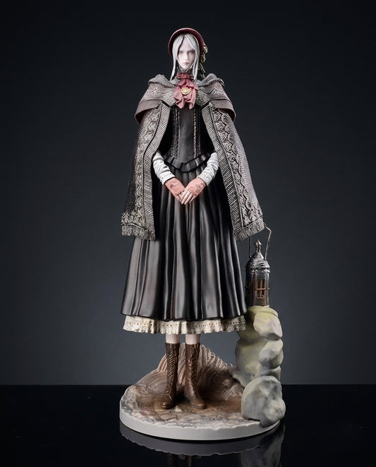 The Doll Bloodborne figurine standing pose with lantern in hand against a soft grey studio backdrop