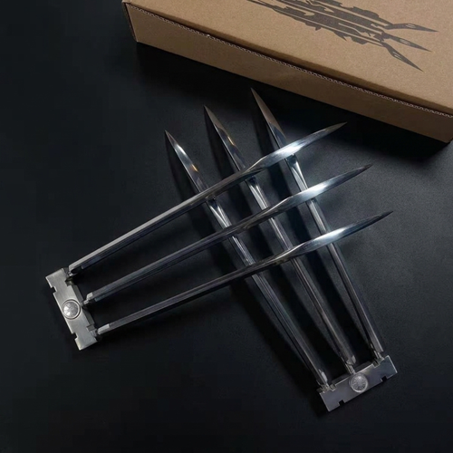 X-Men Wolverine claws metallic claw-like blades arranged on a dark surface, with a brown cardboard box partially visible in the background. Gift For Wolverine Fans, Collectible cosplay display acessories